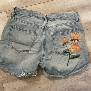 Light denim jeans with flower embroidered pocket
